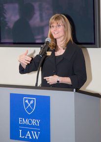 Karen giving presentation from Emory Law podium.